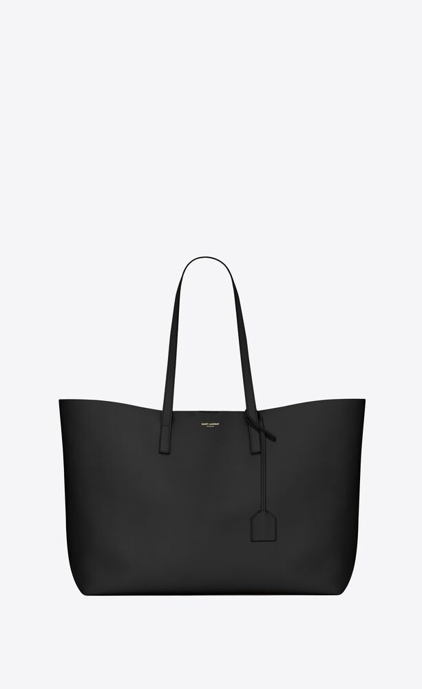 saint laurent unstructured tote bag with flat leather handles and removable leather encased metal... | Saint Laurent Inc. (Global)