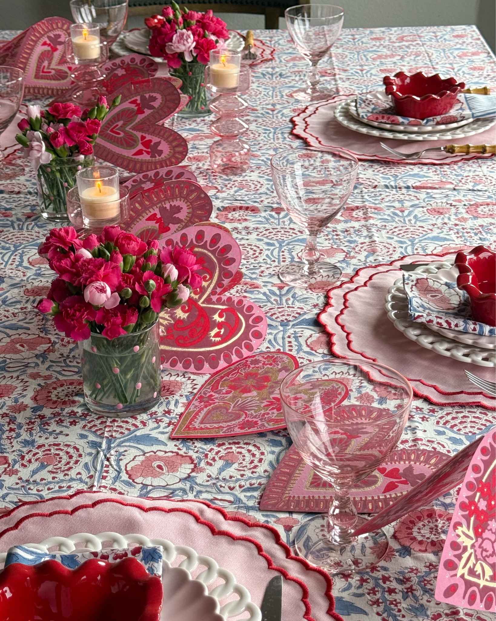 Valentine’s Tablescape Details 💕
Layered plates, a cotton block printed tablecloth in reds, pinks, and blues, candlelight, and mini floral arrangements to make the table feel extra special. 
The sweetest finishing touch is this heart banner by East End from Paper Source draped across the table — playful, festive, and perfect for February entertaining.


#LTKhome #LTKseasonal #ValentinesTable #TablescapeIdeas #MeriMeri #EntertainingAtHome #HostessStyle

#LTKfoodie #LTKSeasonal #LTKValentine