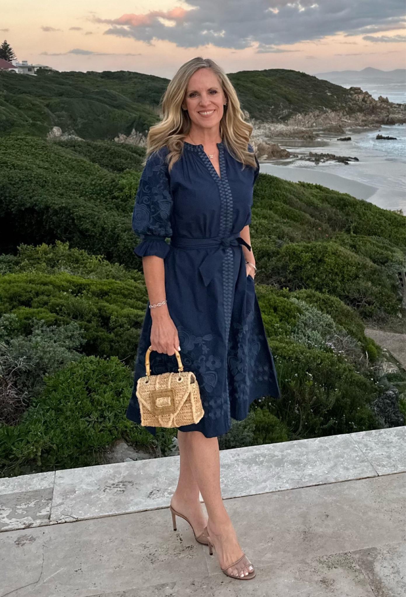 This dress that sold out quickly the first time is back in stock in all sizes!
I love this floral embroidered navy dress from Julia Amory the color is called twilight
If it’s true to size, and I’m wearing  XS
I wore it on vacation in South Africa. It’s a great go to dress for dinner or a luncheon. It travels well, and steams out easily.

#LTKSeasonal #LTKOver40 #LTKStyleTip
