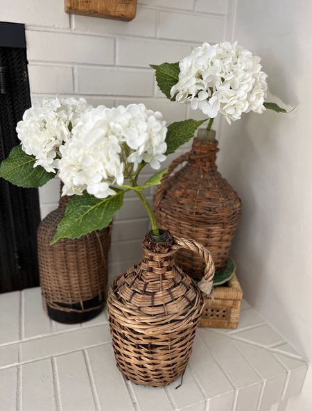 These are the most realistic faux hydrangeas! They are so pretty and go with any type of decor! You can also shop similar wicker demijohns to the ones seen in this picture  


#LTKFindsUnder100 #LTKSeasonal #LTKHome