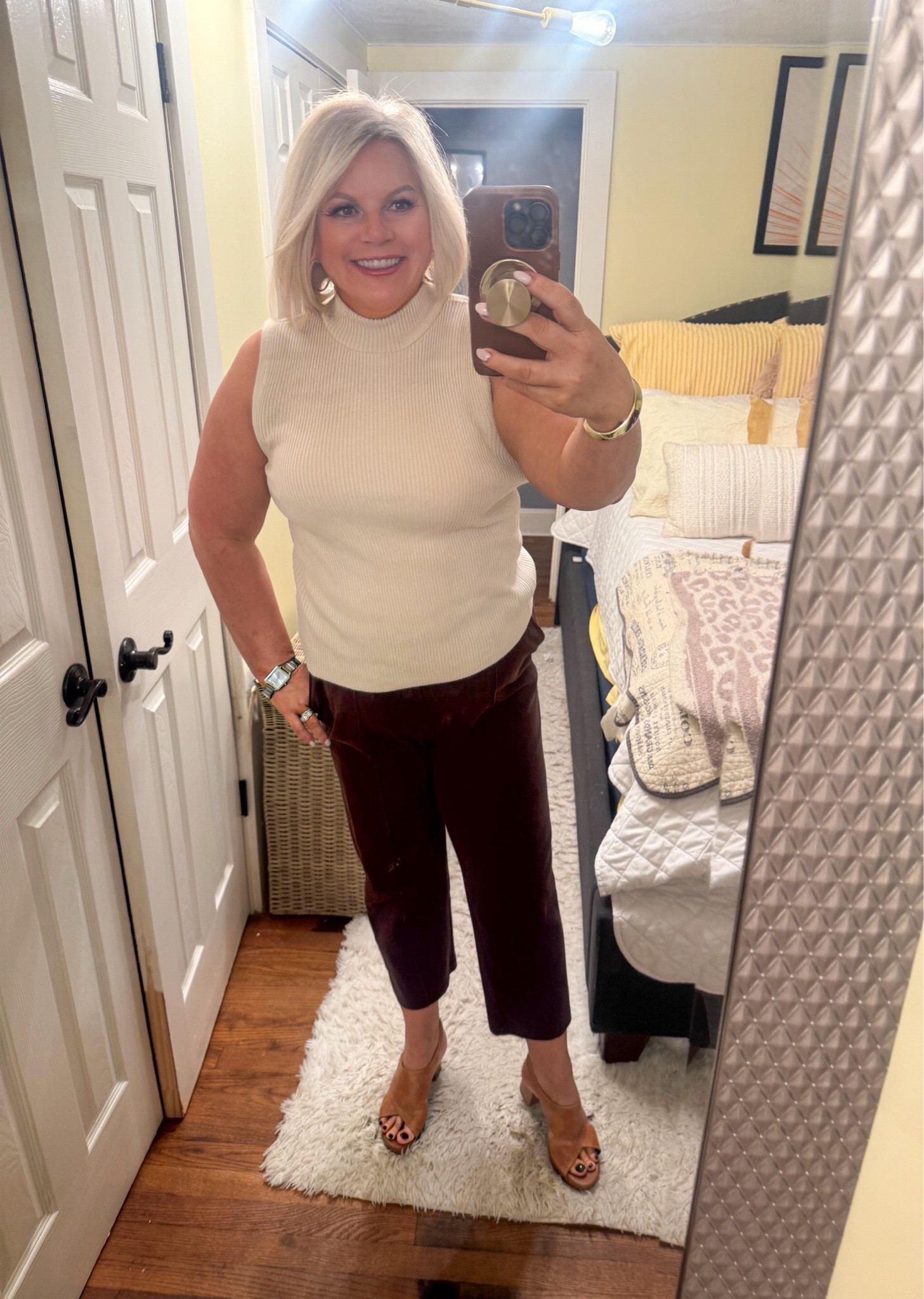 The focus now is things that can currently be worn, while still being appropriate for fall as well.
Today, in August I wore this sleeveless mock neck top and chocolate brown pants with heeled sandals. In the fall, I'll add a cardigan and swap the sandals for ankle boots.
Business casual outfits, over 40 work outfits, Fall transition outfits, natural outfits

#LTKdayinmylife #LTKootd #LTKWorkwear