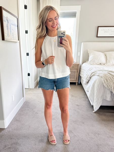White halter style tank top from Target paired with 4” Abercrombie mom shorts 

#LTKStyleTip #LTKTravel #LTKFindsUnder50