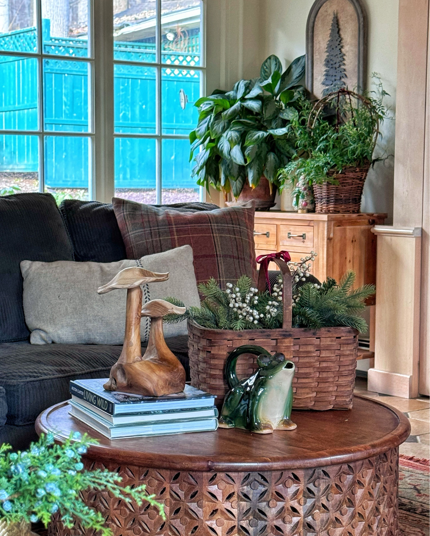 Boho Christmas decor in the family room with lots of plants and organic decor

#LTKSeasonal #LTKHoliday #LTKHome
