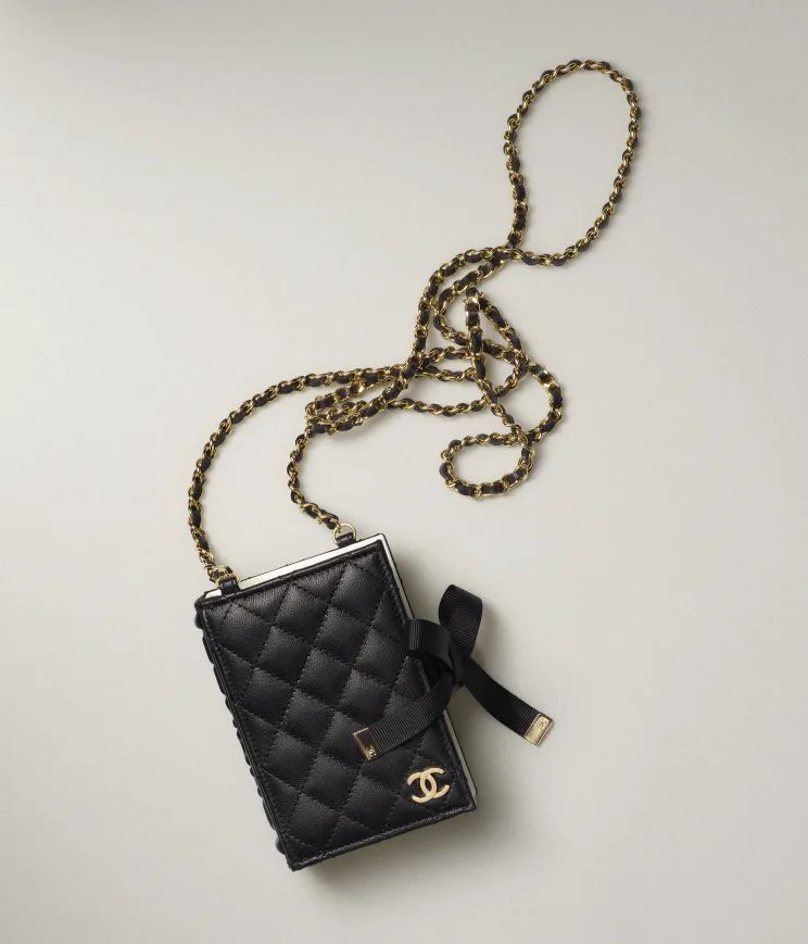 Card Holder with Chain

            
		Lambskin & Gold-Tone Metal
	
		Black | Chanel, Inc. (US)