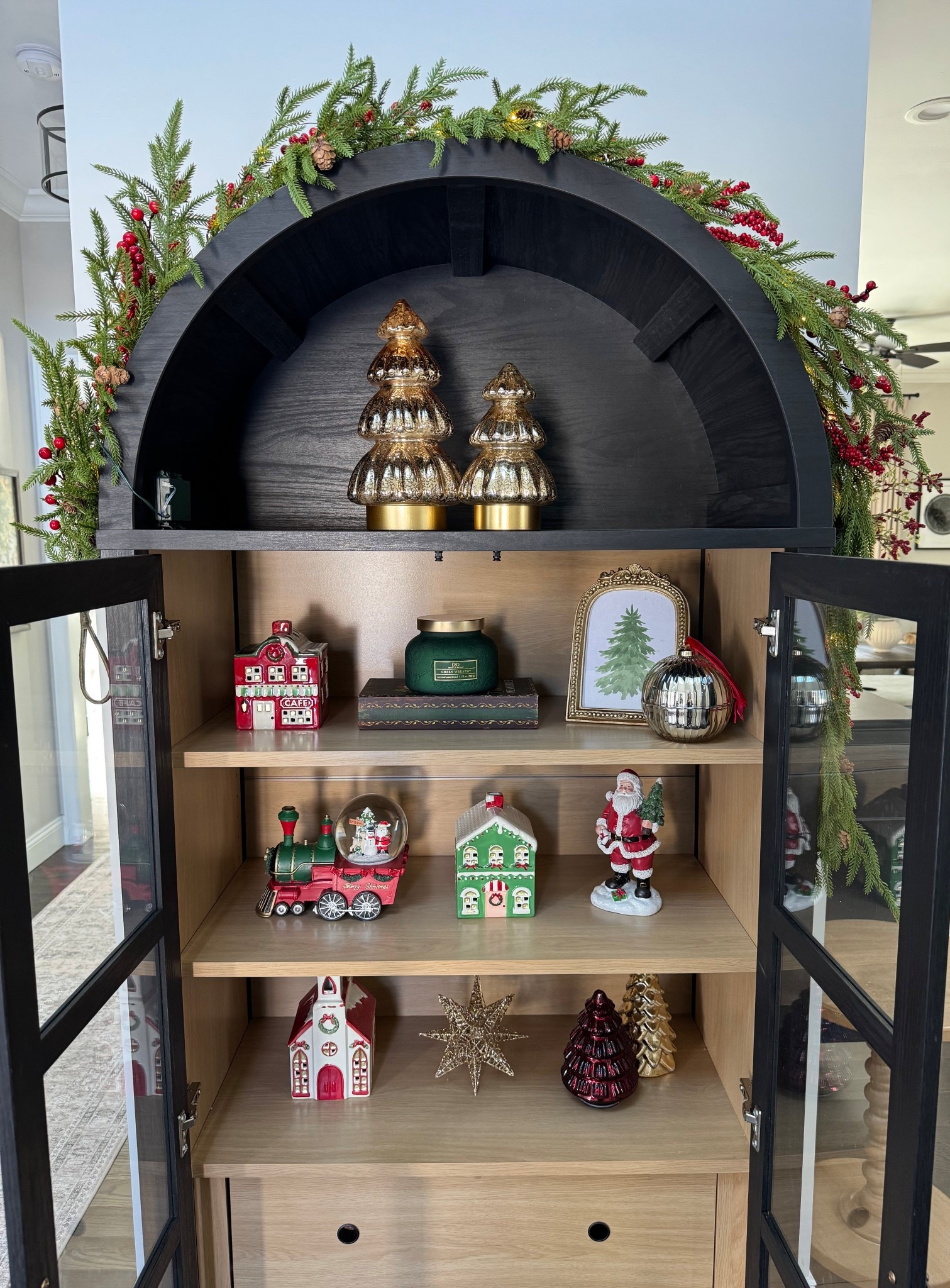 Christmas cabinet styling ❤️

Christmas village. Gold decorative trees. Target style. Black arch cabinet. 

#LTKHoliday #LTKGiftGuide #LTKCyberWeek