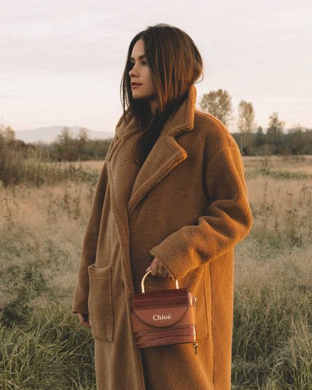 Sarah Butler of Sarahchristine wearing Easy fall outfit idea: brown faux shearling coat accessorized with a Chloe Aby lock small leather shoulder bag.
Fall fashion inspiration, Stylish fall outfit ideas, Brown faux shearling coat, Chloe leather shoulder bag, Autumn wardrobe essentials, Cozy fall outfit, Shearling coat outfit, Designer handbag styling
FOLLOW: 
• SarahStylesSeattle.com
• instagram.com/sarahchristine

#LTKitbag #LTKSeasonal #LTKfindsunder100