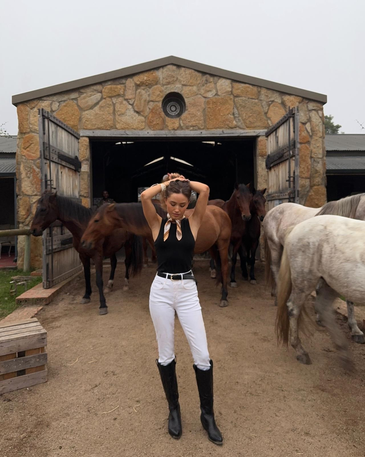 Riding out days🐎 wearing a black Taktik, white straight leg denim, high knee cowboy boots and a little silk scarf 

#LTKFashionMonth
