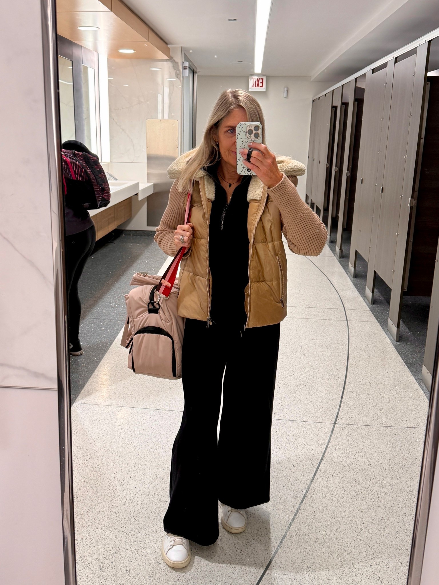 Comfy chic travel outfit. Spanx air tight essentials half zip and wide leg pants. Calpack weekender bag.

#LTKOver40 #LTKdayinmylife #LTKTravel