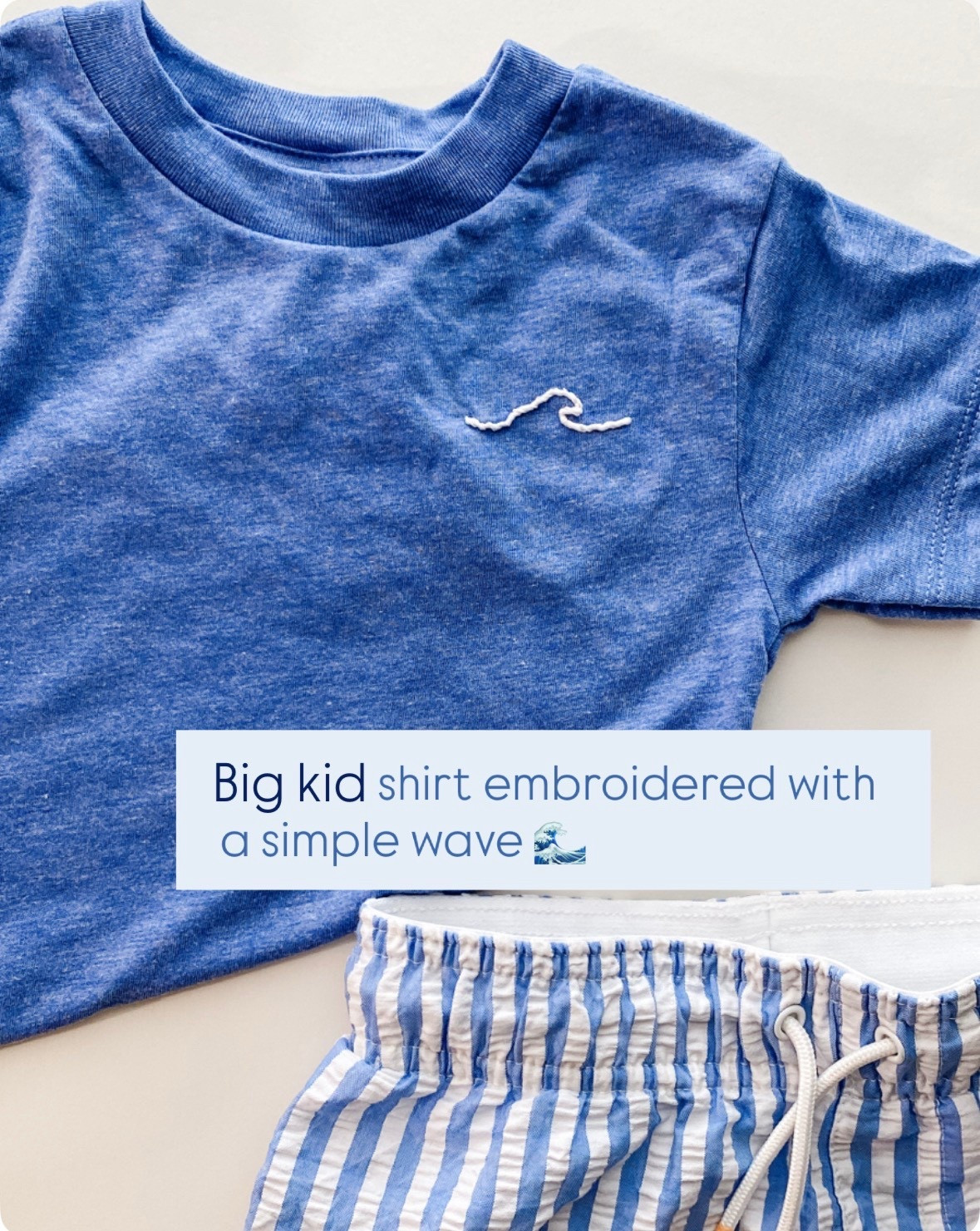 Hand embroidered wave on a blue tshirt for summer 