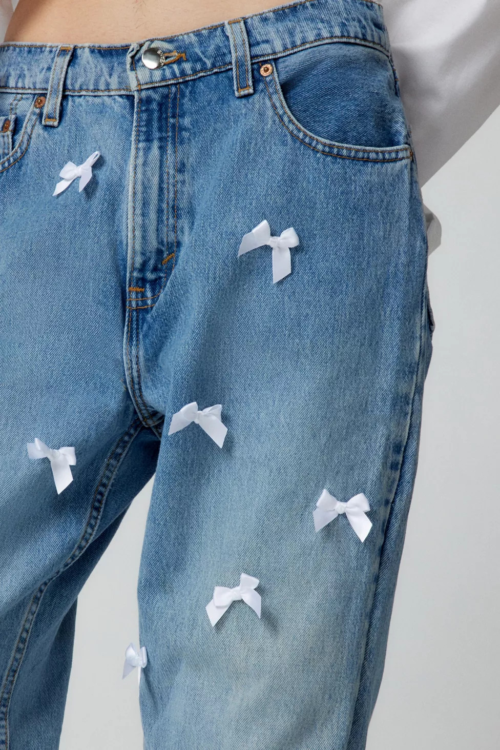Urban Renewal Remade Levi's Allover Bow Jean | Urban Outfitters (US and RoW)