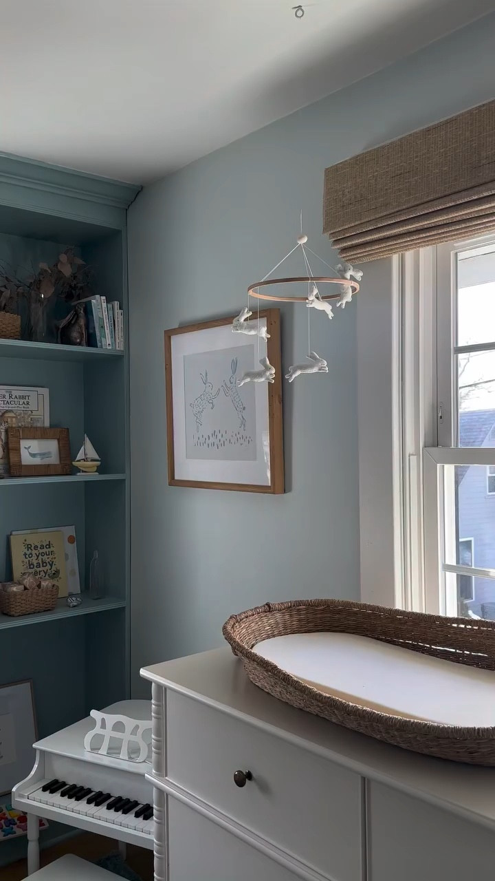 We easily moved from nursery to toddler space through this paint update. The blue on blue layer feels grounded, but youthful. Maybe one day we’ll take the bunny mobile down, but this space already feels night and day 😅 

Walls: Lookout Point by Benjamin Moore
Shelves and Cabinet: Cabe Blue by Benjamin Moore

Shop the entire space by commenting BLUE 

#toddlerroom #boyroom #interiordesign #bluepaint #paintcolors