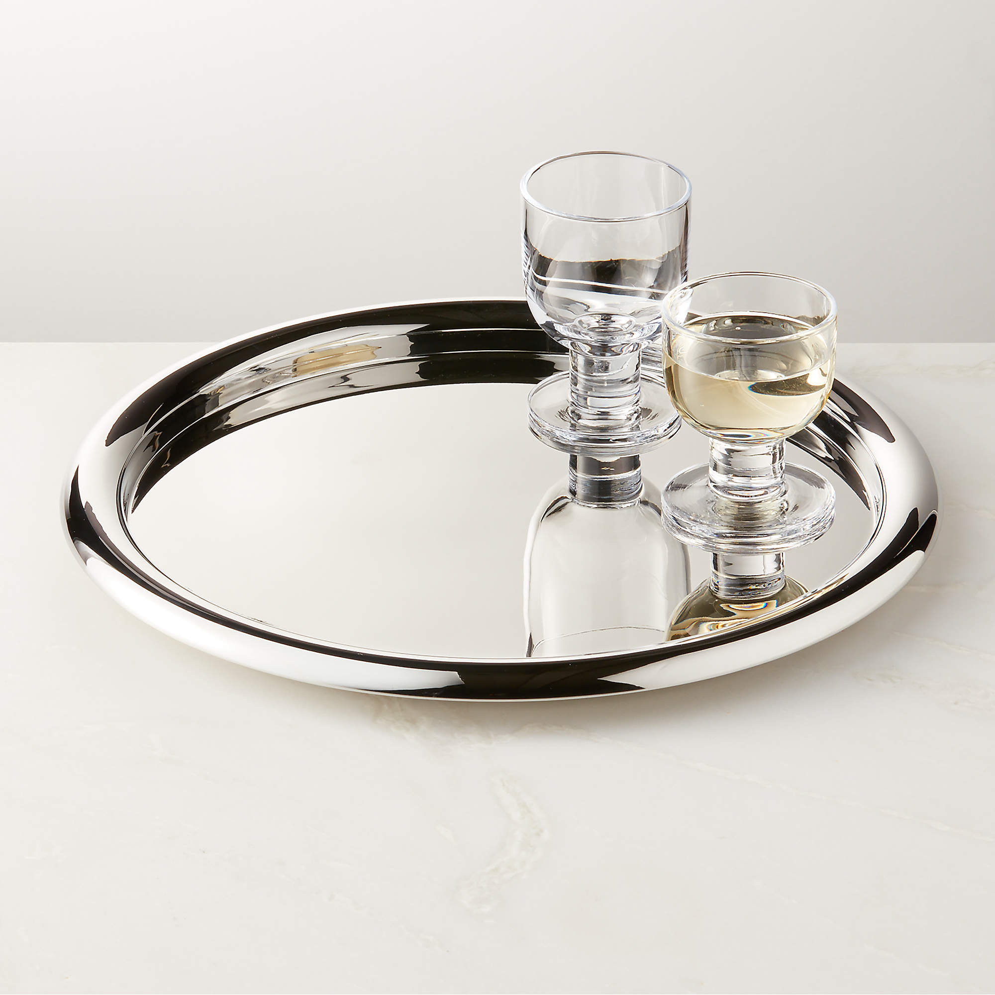 Piero Round Polished Stainless Steel Serving Tray by Gianfranco Frattini + Reviews | CB2 | CB2