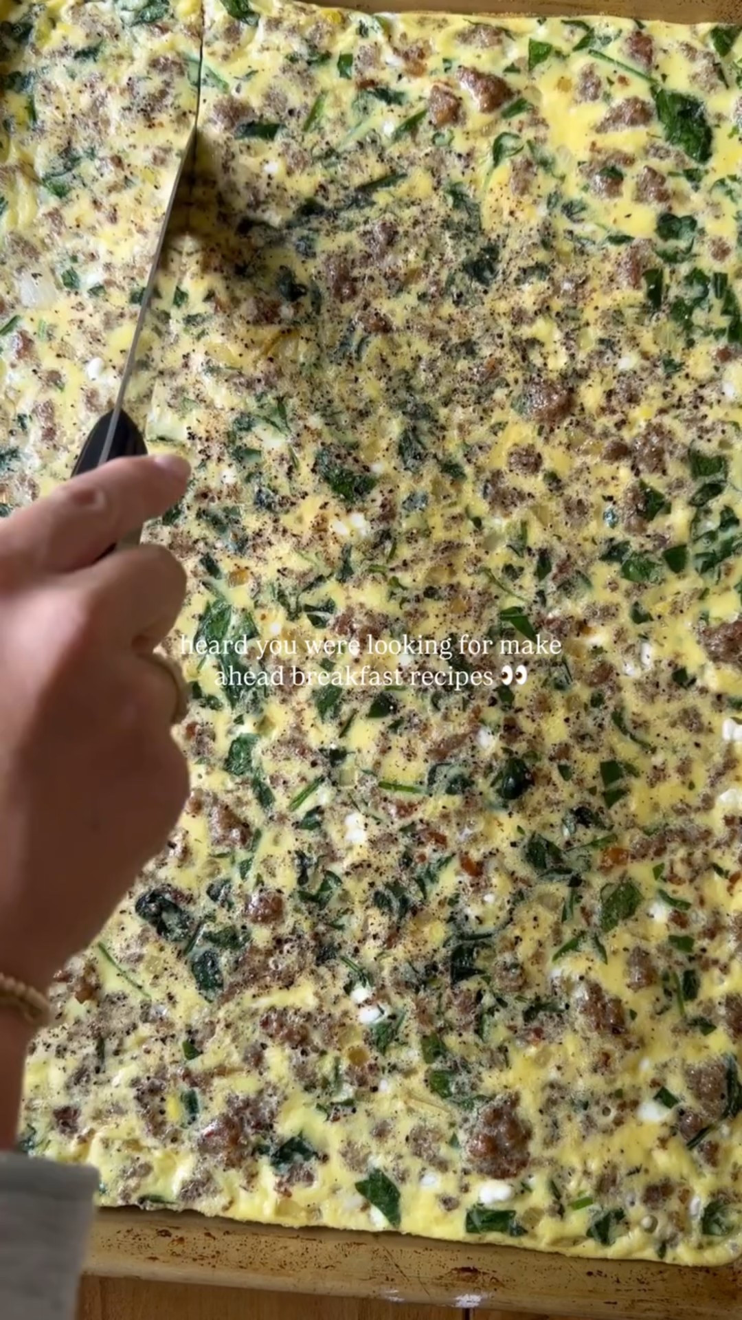 these viral make ahead breakfast sandwiches will make your mornings easier in the new year! you can find the full recipe below! 

Ingredients:
18 English muffins 
18 havarti cheese slices 
16 eggs 
1/3 cup cottage cheese 
1 lb ground sausage
1 small sweet onion, diced 
1 cup chopped baby spinach
1 tbsp softened butter 
 Salt, to taste
Pepper, to taste 

Instructions: 
1. Preheat oven to 350 degrees. 
2. In a large bowl, crack 16 eggs and add 1/3 cup cottage cheese. Season with salt and pepper. Whisk well and set aside. 
3. In a large pan or skillet over medium high heat, cook ground sausage until brown and no longer pink, breaking apart into small pieces with the end of your spatula. Once cooked, remove the meat, drain some grease, and set the meat aside. 
4. In the same pan over medium heat, add diced onion. Sauté for 1-2 minutes and season with salt and pepper. Add chopped spinach and cook until wilted. Once everything is cooked, set aside. 
5. In the bowl of whisked eggs, add cooked sausage, and sautéd onions and spinach. Stir to combine. 
6. Grease a sheet pan with butter then pour in the egg mixture flat on the pan. 
7. Place the sheet pan into the oven to bake for 15-20 minutes. 
8. Once the egg is cooked through, remove from the oven and slice into squares. 
9. Assemble the sandwich by slicing an English muffin in half, add an egg square, and top with cheese. Close the sandwich and wrap in aluminum foil or parchment paper. Store in the freezer for up to 3 months or serve immediately.

Note: to reheat, unwrap the sandwich and place it into a damp paper towel. Microwave for 2-3 minutes and enjoy!