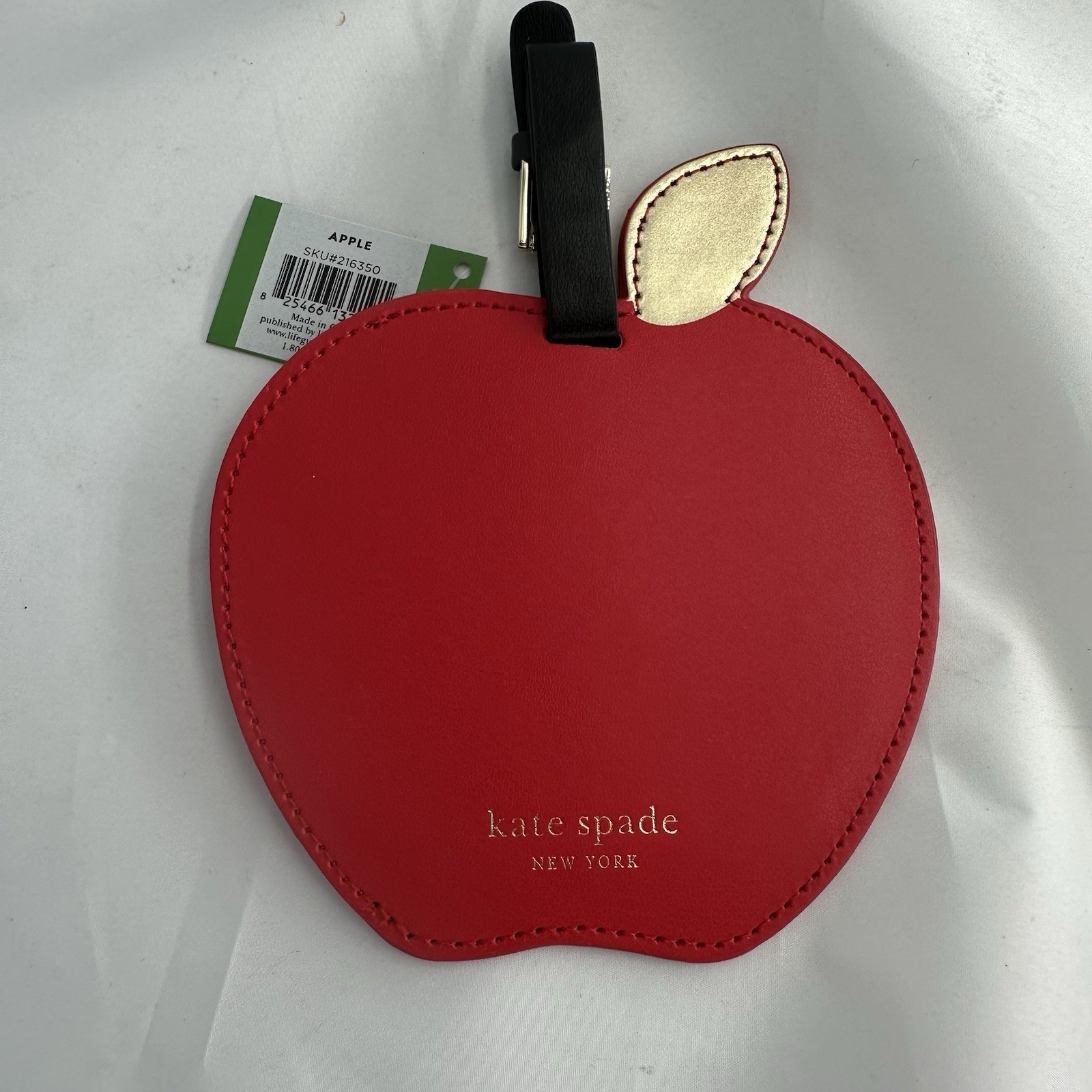 Kate Spade New York Red Apple Leather Luggage Tag, round vegan leather bag tag with buckle