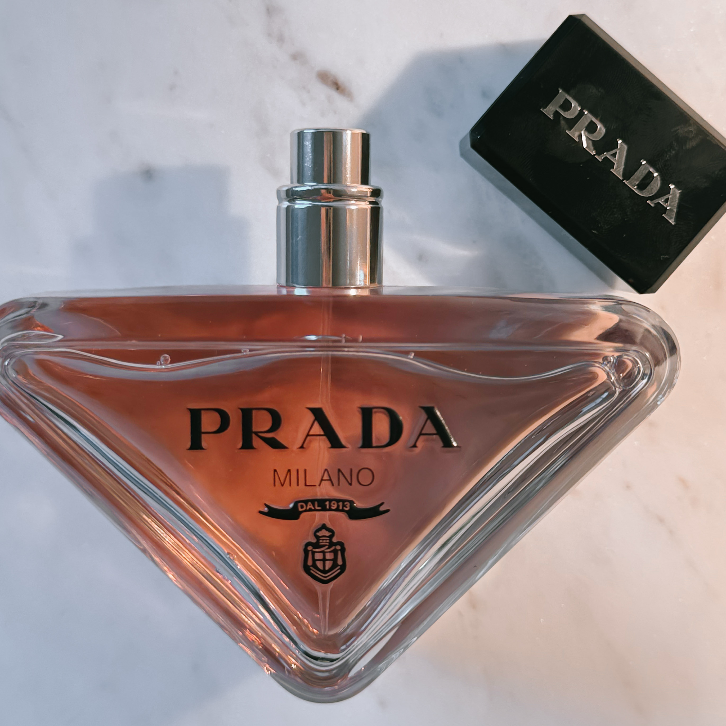 Perfume Review: Prada Paradoxe Eau de Parfum

Some perfumes whisper. Some shout. And then there are the ones that walk into the room before you do—with confidence, intention, and a little bit of mystery. That’s Prada Paradoxe.
This scent has been everywhere lately, and after using up every last spritz of the sample (and then going back for the full size), I have thoughts. It’s elegant, bold, a little unconventional—and yes, it smells expensive in the best way possible. It's not your soft, delicate floral… it's the "I’m not trying to be liked, but you’ll remember me" kind of energy. And I mean that as a compliment.
Let’s break it down.

#LTKPlusSize #LTKBeauty #LTKOver40