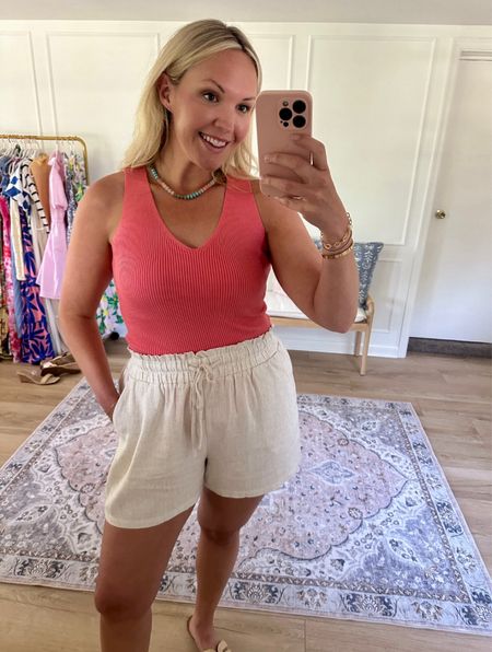 Linen blend drawstring shorts, wearing a large. Paired with this sweater tank such a great combo, I’m wearing a med. summer outfit, travel outfit 

#LTKSeasonal #LTKMidsize #LTKStyleTip