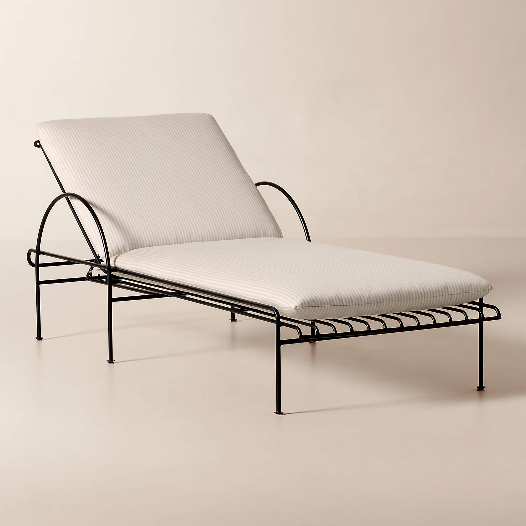 Costa Black Metal Outdoor Sun Lounger with Natural And White Striped Sunbrella Cushions | CB2 | CB2