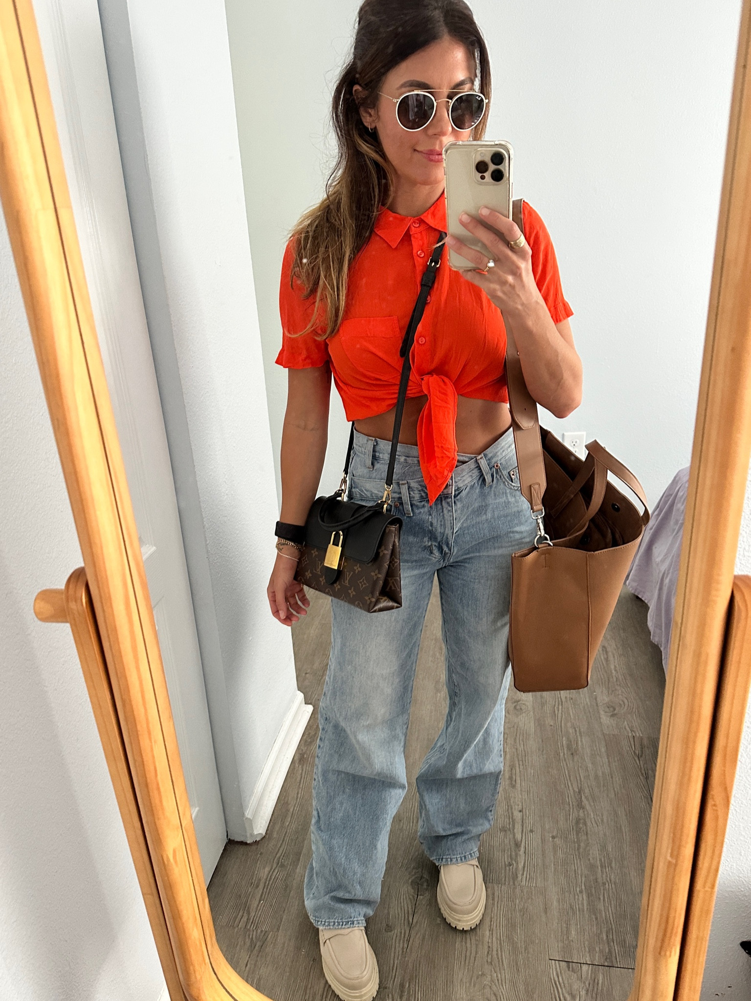 If you’re anything like me (petite but pear shaped/hourglass) you can feel overwhelmed or frumpy in baggier cuts of jeans although they’re super comfortable. I like to accentuate my waist in roomier pants so I still have a shape and don’t look large or overwhelmed by fabric all over. If you’re not comfortable showing midriff, try doing this with a more tailored or fitted top that ends right at the waist of your pants, tying a button down right at the point you feel comfortable showing off (anything above the waist of your jeans, or wear a slim fitting bodysuit 🧡 #widelegjeans #flatteringwidelegjeans #pistoladenim

#LTKSeasonal #LTKstyletip