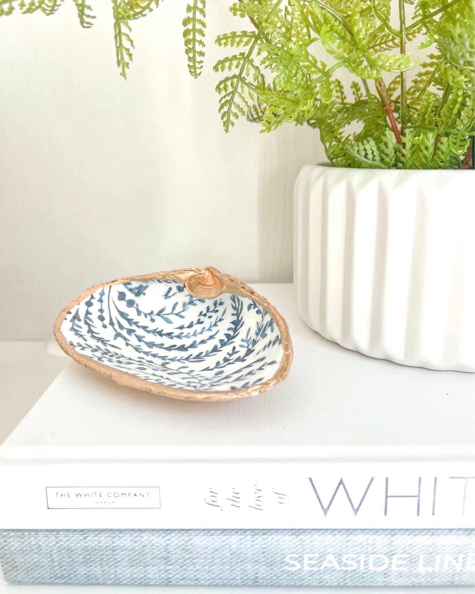 The perfect coastal accent to add to a coffee table tray, shelf, nightstand, or to place on top of a pretty coffee table book! 

Serena & lily, priano wallpaper, coastal style, coastal home decor, beach style, beach house home, beach house home decor, neutral home aesthetic, coastal aesthetic, designer look for less, designer inspired, ring dish, hostess gift, coastal decorating, coastal accessories, neutral home

#LTKHome