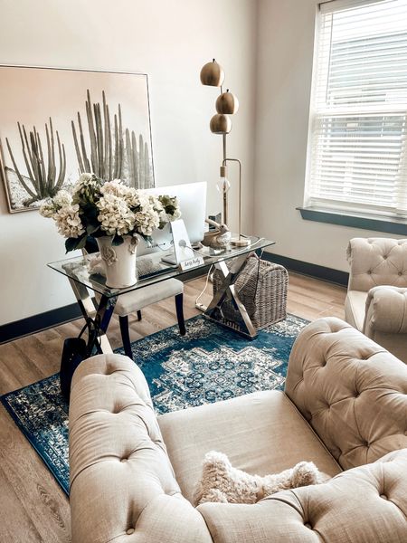 Chic home office. Cactus gold framed canvas art. Glass desk. Tufted club chairs.

#LTKSeasonal #LTKstyletip #LTKhome