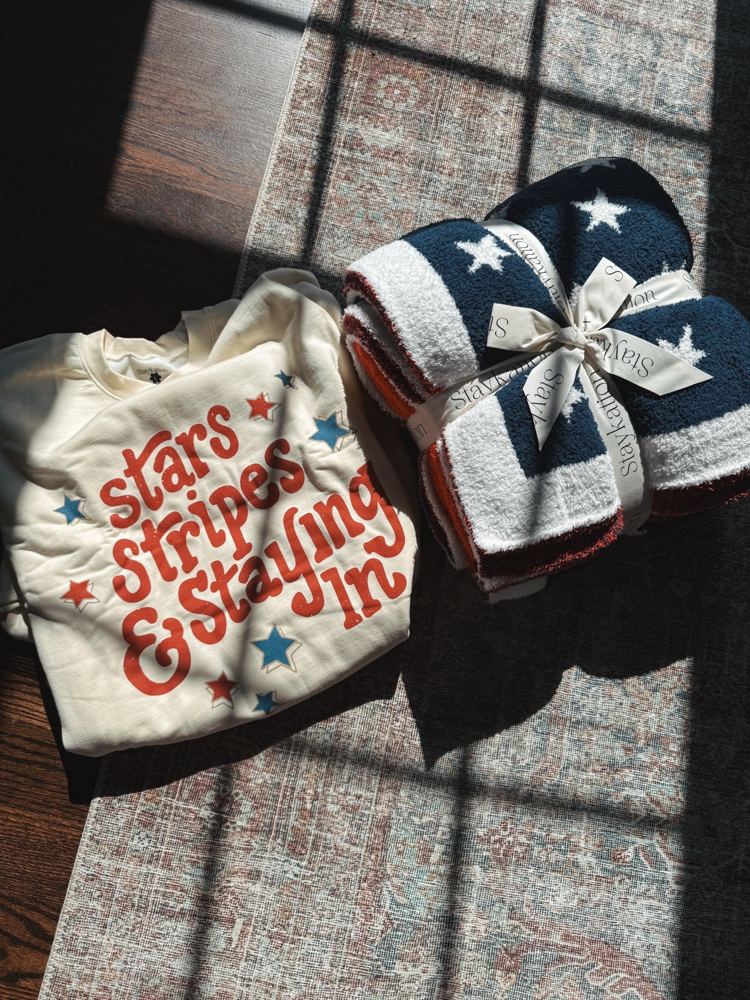 The CUTEST red white & blue blanket and sweatshirt from @shopstaykation ❤️⭐️

#LTKselfcare #LTKmorningroutine #LTKdayinmylife