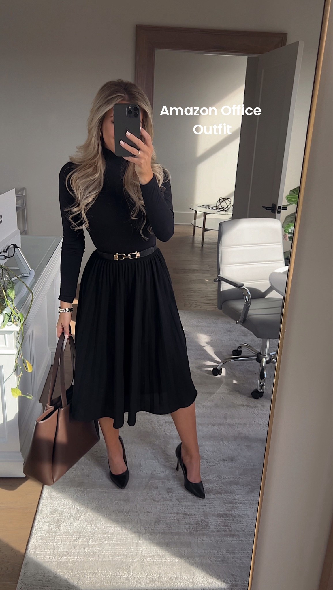 Obsessed with this classic staple office outfit from Amazon! So affordable and such great quality! This black midi skirt paired with a black turtleneck makes for a sleek look! Wearing XS in top and small in bottom! 

#LTKFindsUnder50 #LTKWorkwear