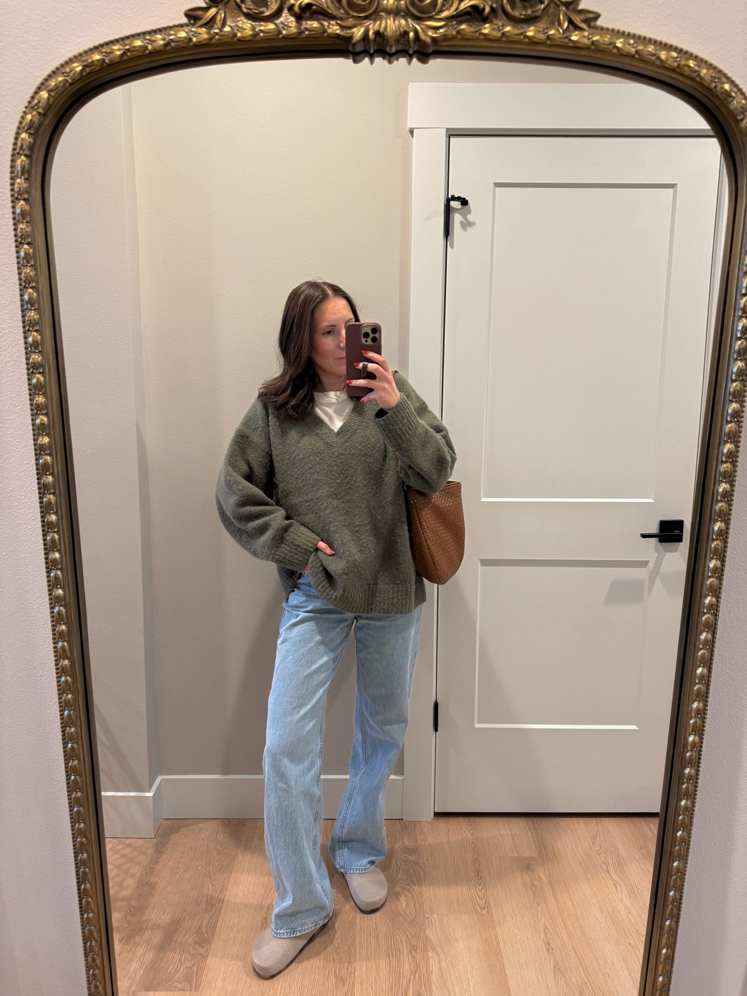 OOTD🤎 this outfit has been on repeat lately. I love this cozy oversized sweater and own it in a few colors! Wearing a size small, small tee and size 25 denim

Casual outfit | v-neck sweater | clogs | woven bag | outfit idea | style over 30 

#LTKootd