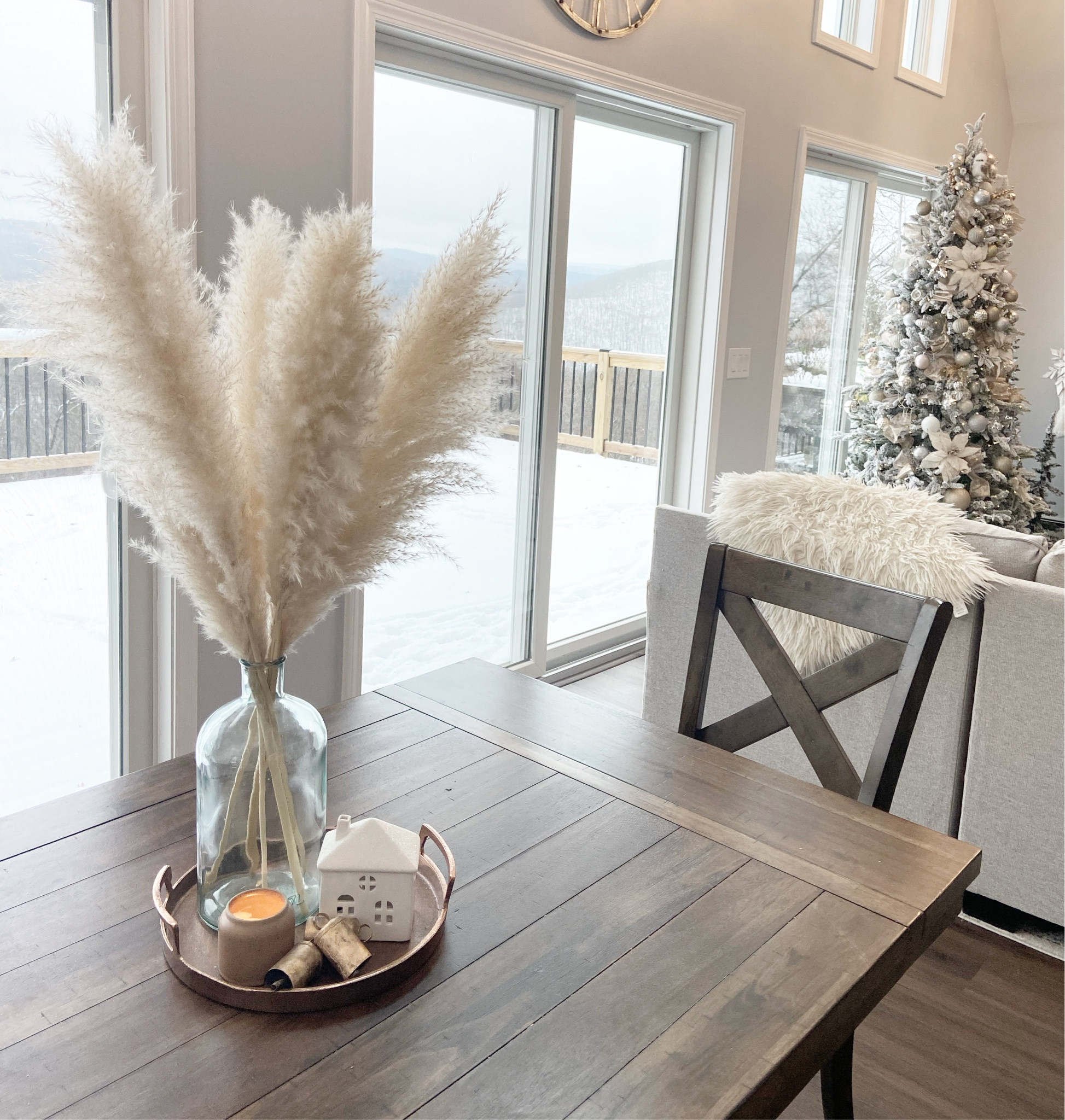 White Christmas, flocked Christmas tree, pampas grass, white poinsettia tree picks, brass bells, Christmas decor finds 

#LTKSeasonal #LTKHoliday #LTKhome