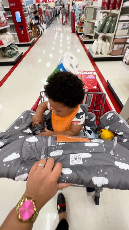 This shopping cart cover is a must have for any mommas with babies and toddlers. I remember the first time I tried to put my son in a bare shopping cart, he said absolutely no, momma. And I had to carry him through the store while pushing a cart (spoiler, I cut the trip short). So I purchased this cover and it’s been a game changer. 

Now I’m able to shop peacefully while my son rides in the shopping cart and I don’t have to worry about germs either. The cover has two spots where you can fit a bottle and a tumbler for yourself. You can also attach some toys to it to keep
The little one occupied and I love that it has an insert where you can place your phone and let them watch a show while you shop. This shopping cart cover makes a great gift for a new momma or mommy to be. It also fits most carts plus its machine washable.

#LTKCyberWeek #LTKbaby #LTKsalealert