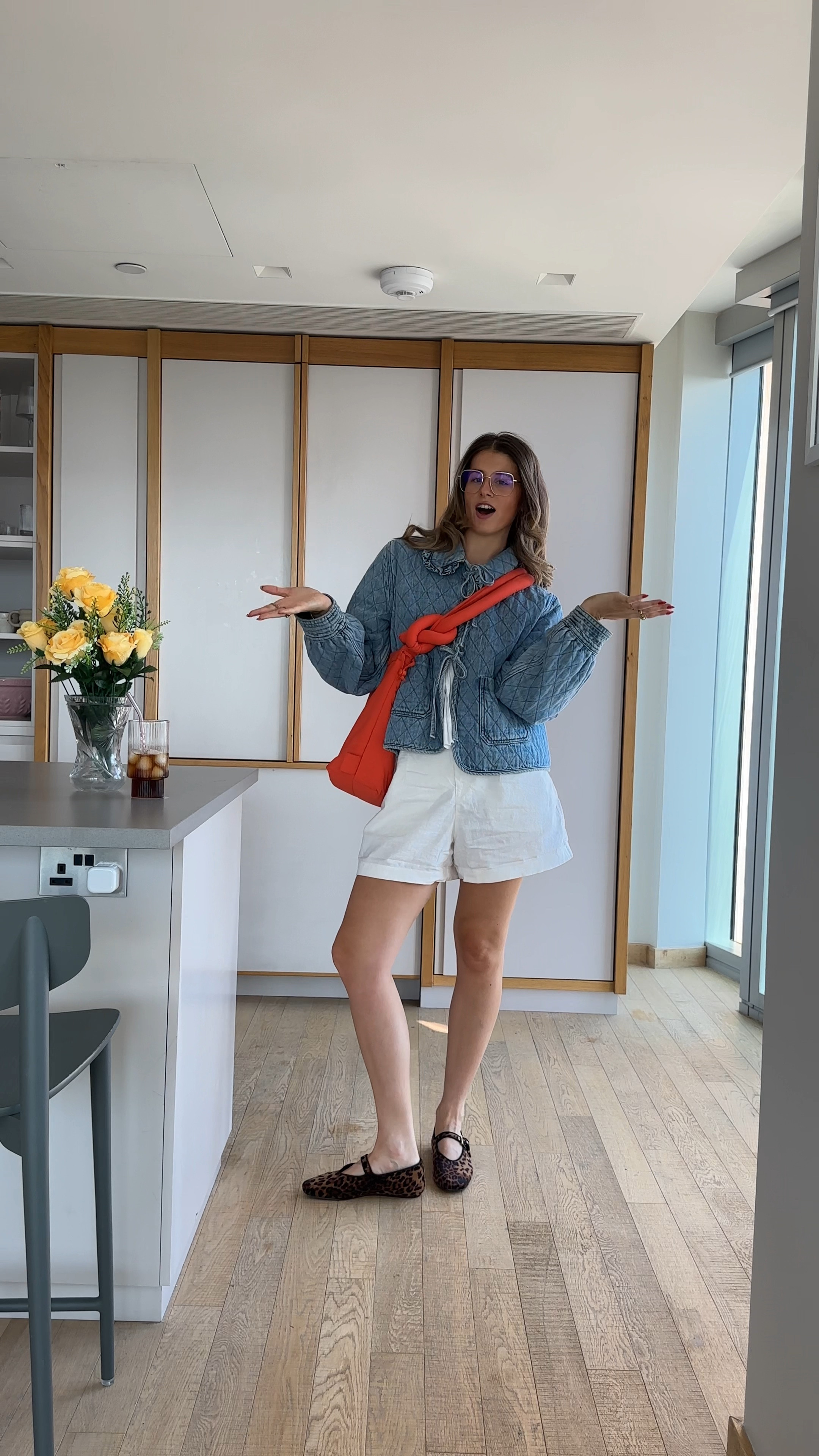 Anthropologie denim bow tie up blue jacket, white ganni style bow tie up blouse top, linen white cream Uniqlo shorts tie waist, Mary Jane ballet flat H&M leopard print gold framed glasses asos summer workwear office outfit inspo 

#LTKsummer #LTKeurope #LTKworkwear