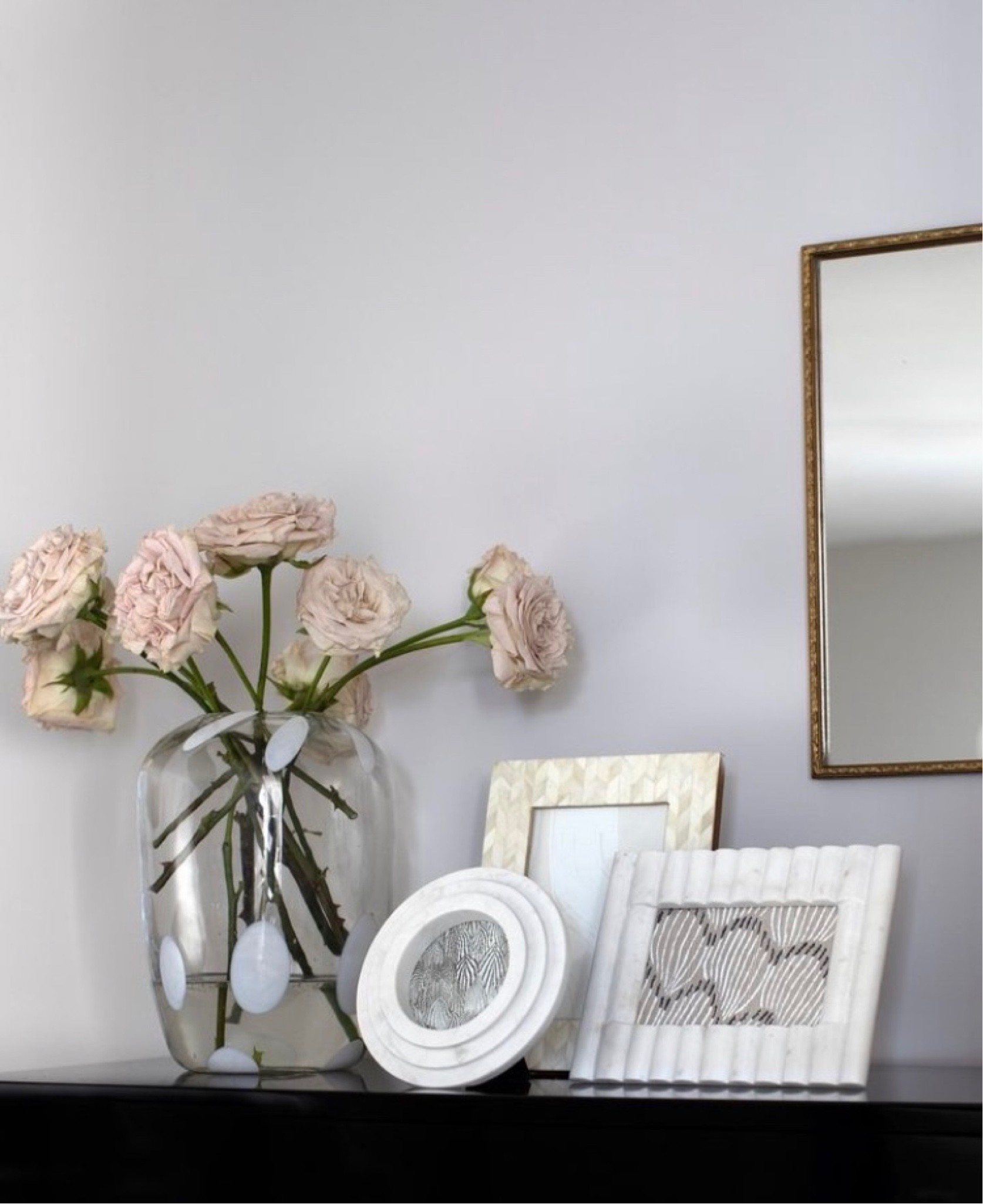 Effortless weekend styling trick — group three frames of graduating heights together, then add a modern vase of seasonal blooms. Et voila! A vignette to admire Friday to Sunday 🥂

#LTKhome #LTKstyletip
