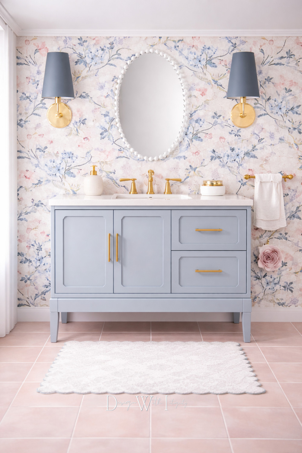 Soft florals, warm brass, and a calming blue vanity come together to create a bathroom that feels both romantic and refined. The delicate wallpaper sets a graceful backdrop, while tailored lighting and classic hardware add structure and polish. Blush floor tile warms the palette and keeps the space feeling light, layered, and thoughtfully styled.

This design was inspired by a digital mood board and generated through AI as a visual concept, offering inspiration for how color, pattern, and timeless finishes can work together beautifully. Tap through to shop the look on LTK and explore the pieces that bring this space to life.

Shop the look on LTK.

#bathroominspiration #interiordesign #shopthelook 

 #LTKHome