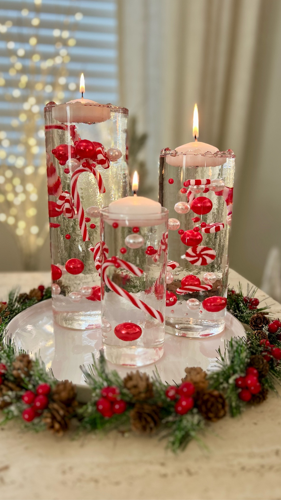 Floating peppermint candle holder. Christmas DIY. Peppermint Christmas vases. 

#LTKHome #LTKHoliday #LTKSeasonal
