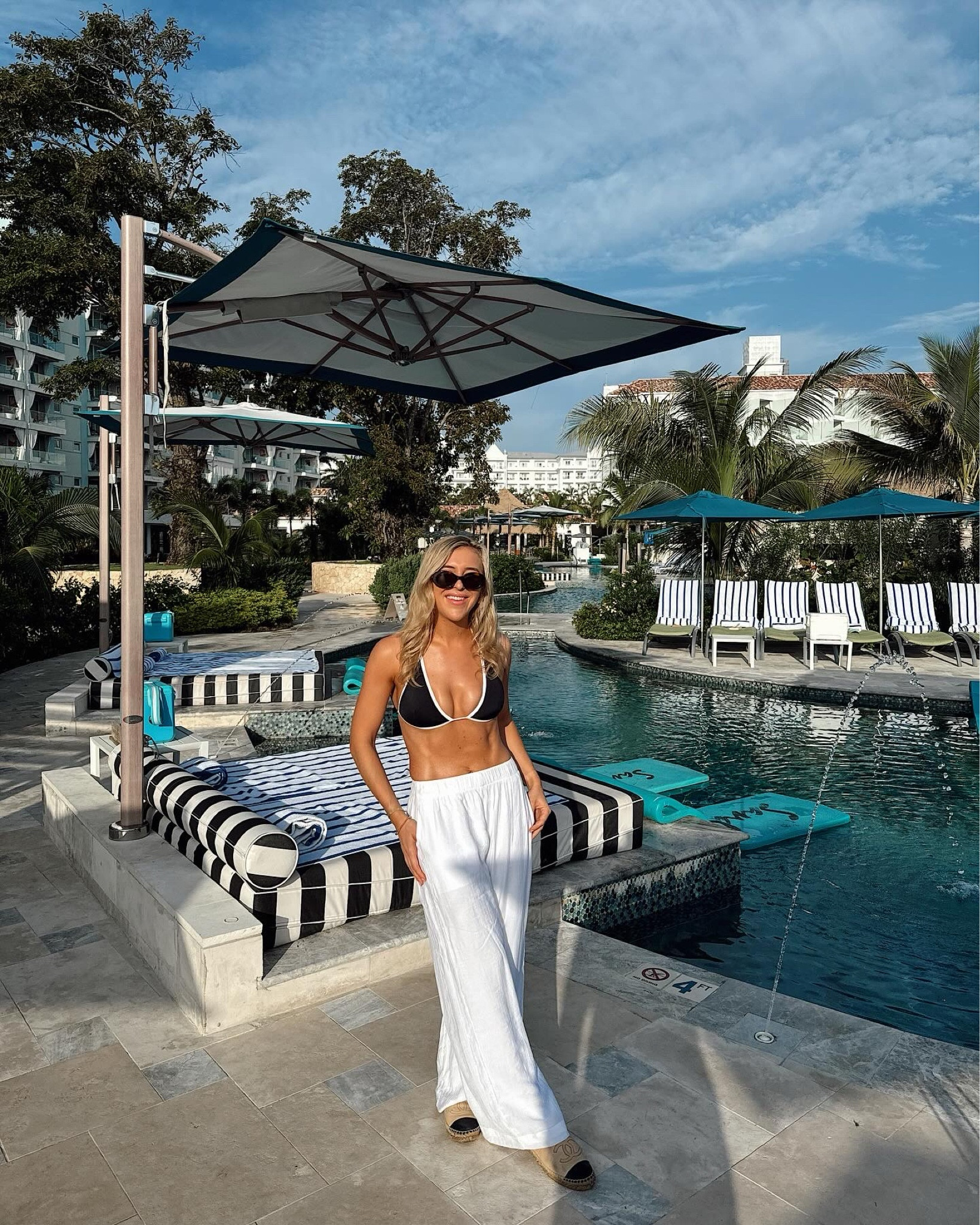 Bikini - black and white bikini - summer style - summer outfit - holiday style - white pants - white trousers - stretchy pants - wide legged pants - Abercrombie - Abercrombie and fitch - black bikini - swimwear - celine sunglasses - celine triomphe - celine glasses - designer sunglasses - tailored trousers 

#LTKtravel #LTKswim #LTKfindsunder50