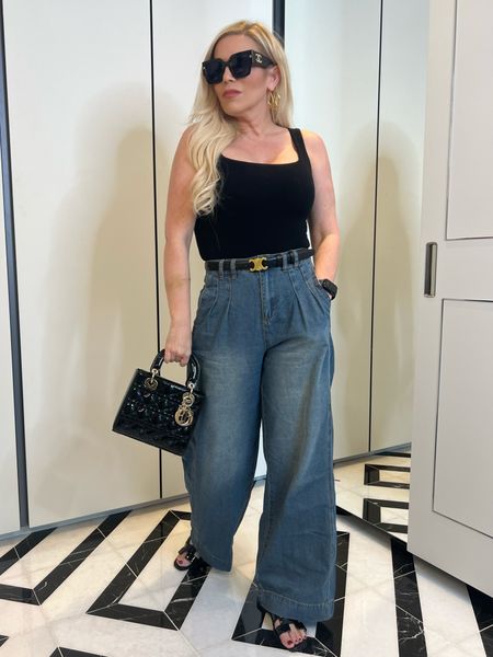 Spring Outfit
Pleated Wide Leg Denim Jeans - Wearing a 6, but maybe could have taken a 4. They have a little adjustment tab in the back - Comes in 3 washes!
Black NW Tank Bodysuit - This brand is my fave. Wearing a S
Celine Belt Dupe!
Hermes H Sandals Dupes

#LTKfindsunder50 #LTKstyletip #LTKfindsunder100