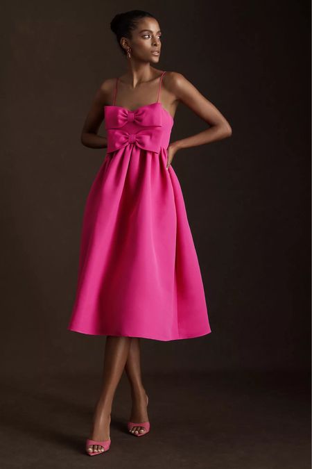 Very feminine dress!! It has two bows in the front and its midi. Also this pink us gorgeous !! 

#LTKxAnthro #LTKsalealert #LTKFind