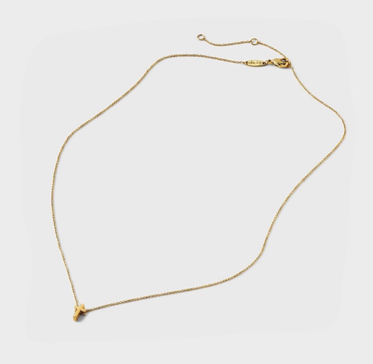The sweetest gold plated petite cross necklace 
