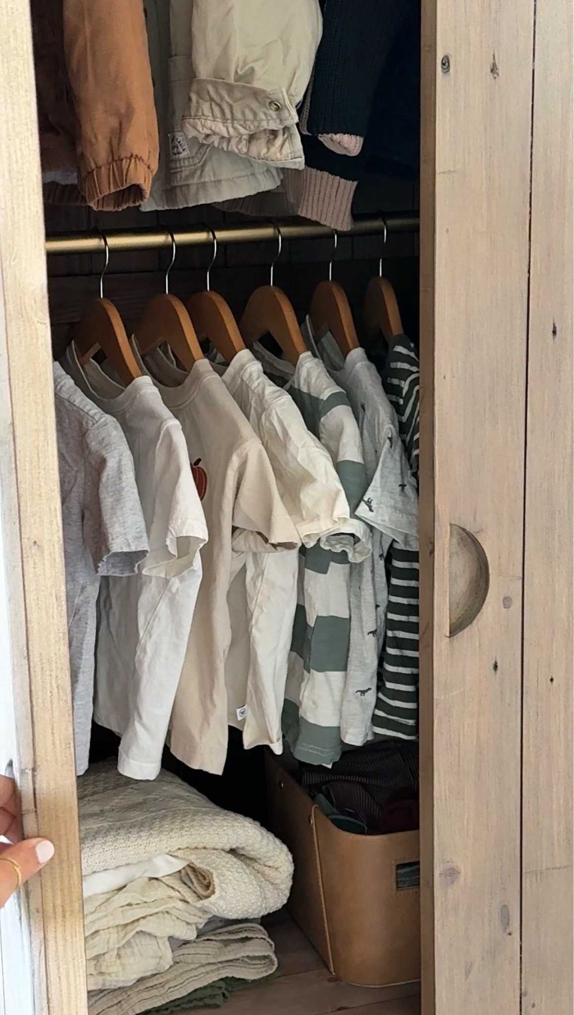 I used a curtain rod to add an extra hanging rod because the armoire only came with one