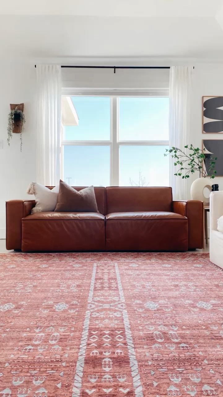 Shop our living room! 
Linked as many exact items as possible & similar items when applicable. Leather sofa is the Sedona-discontinued from West Elm, rug is the Hali Coral/Khaki from Tumble Living. 

#LTKHome #LTKStyleTip