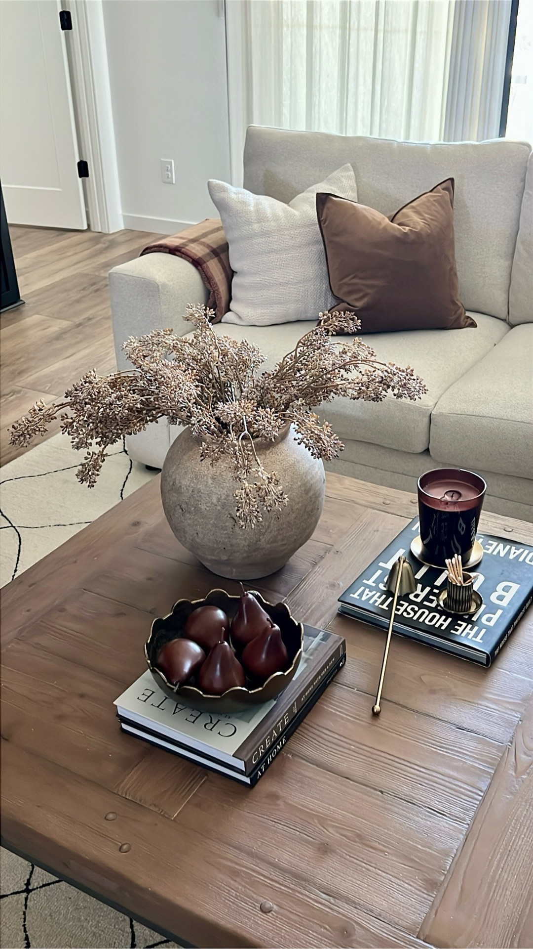 Coffee table styling for fall! Faux pears, brass bowl, rustic pot, textured vase, fall berry stems, plum fall decor, coffee table, books, plum candle decor, fall candles, match holder, brass decor

#LTKHome #LTKSeasonal
