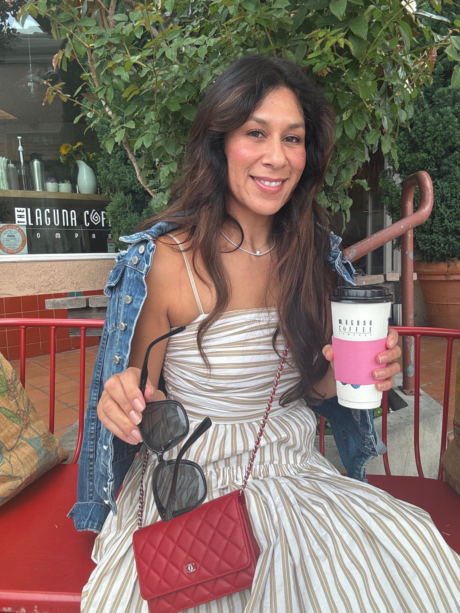 Laguna beach vibes. Flowy dress paired with sneakers, denim jacket and pop or red WOC  

#LTKSeasonal #LTKTravel #LTKStyleTip