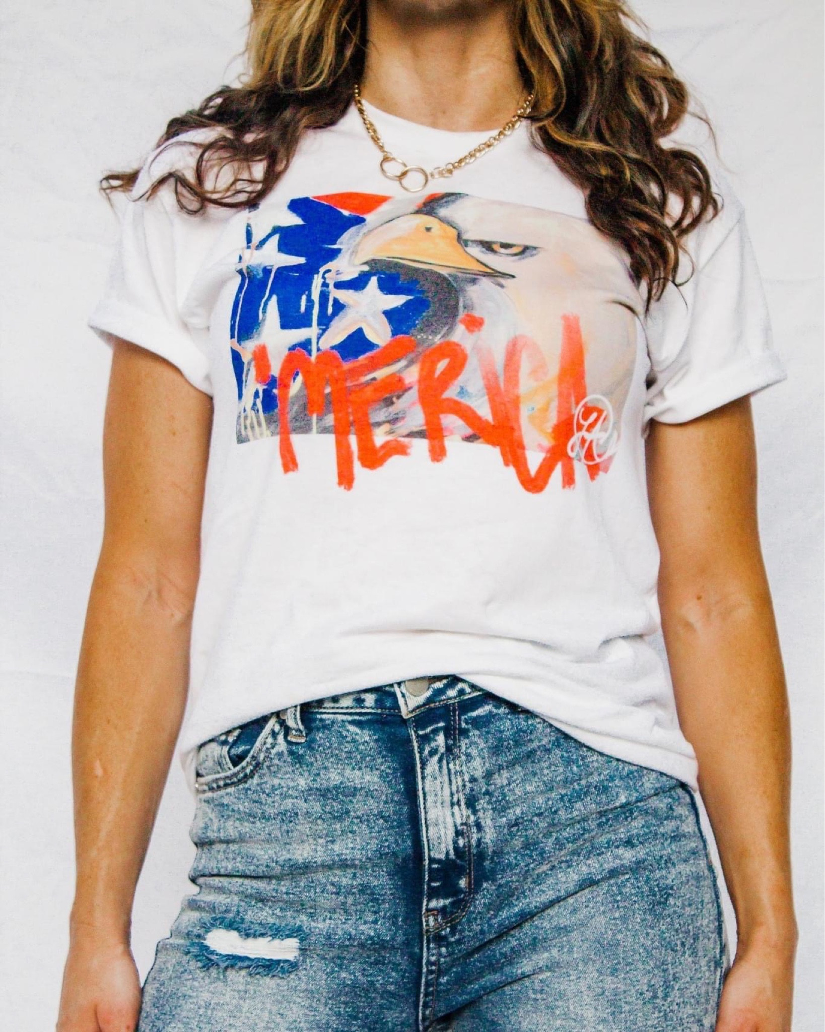 America's birthday is right around the corner and we all know it is a contest to show your true American pride through your outfit! LALA has partnered with Uncut Gems Designs to bring you the LALA eagle painting in shirt form. Grab your shirt now for guaranteed delivery before the fourth. 
