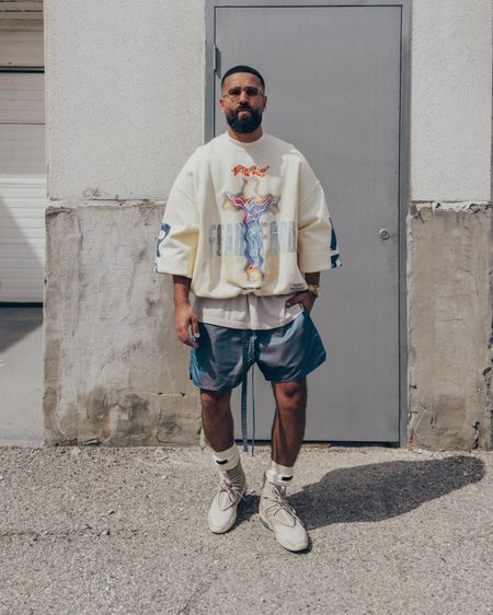 FEAR OF GOD x RRR123 Light Of the World Crewneck Sweatshirt in ‘Cream’ (size 2). FEAR OF GOD 7th Collection Vintage T-Shirt in ‘Vintage White’ (size M), 6th Collection Iridescent Shorts in ‘Blue’ (size M), and 7th Collection socks in ‘Cream’. FEAR OF GOD x NIKE Air Fear Of God 1 sneakers in ‘Oatmeal’ (size 9.5 US). FEAR OF GOD x BARTON PERREIRA glasses. An elevated and relaxed men’s look that is perfect for this Spring and Summer, with light cream and blue tones. 

#LTKstyletip #LTKmens