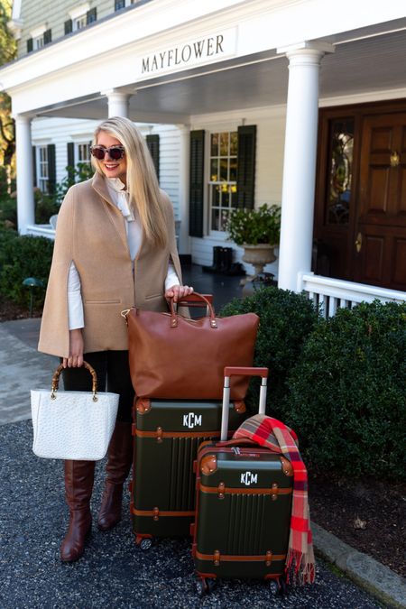 Fall travel style: wool tailored cape, 
Ruffle neck silk shirt, green corduroy pants, brown leather knee high boots, ostrich bamboo handbag, tortoise sunglasses, green and leather luggage set, chestnut leather weekender, plaid blanket scarf

#LTKtravel #LTKover40 #LTKSeasonal