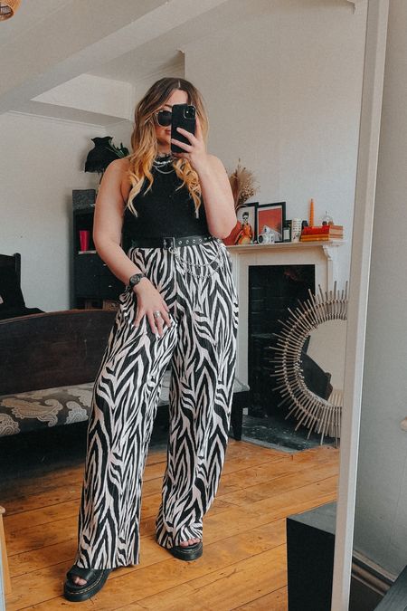 Styling clothes that I don’t typicLly feel comfortable in! This time I’m wearing wide leg zebra trousers, a black top, chain belt, dr marten Clarissa 2 sandals. 

#LTKeurope #LTKunder50 #LTKSeasonal