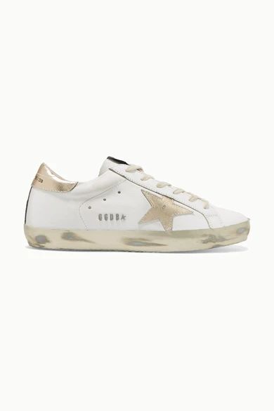 Golden Goose
				
			
			
			
			
			
				Superstar distressed leather sneakers
				$530 | NET-A-PORTER (US)