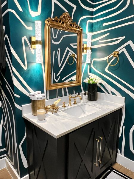 So much of this bathroom is Amazon! My mirror, faucet, sconces! That marble vase was a worth it splurge! 

Bathroom decor, home decor, wallpaper, modern home, green decor, gold mirror, Amazon home, Amazon finds, gold faucet, bathroom hardware, cabinet hardware , bath mat 

#LTKhome #LTKstyletip #LTKsalealert