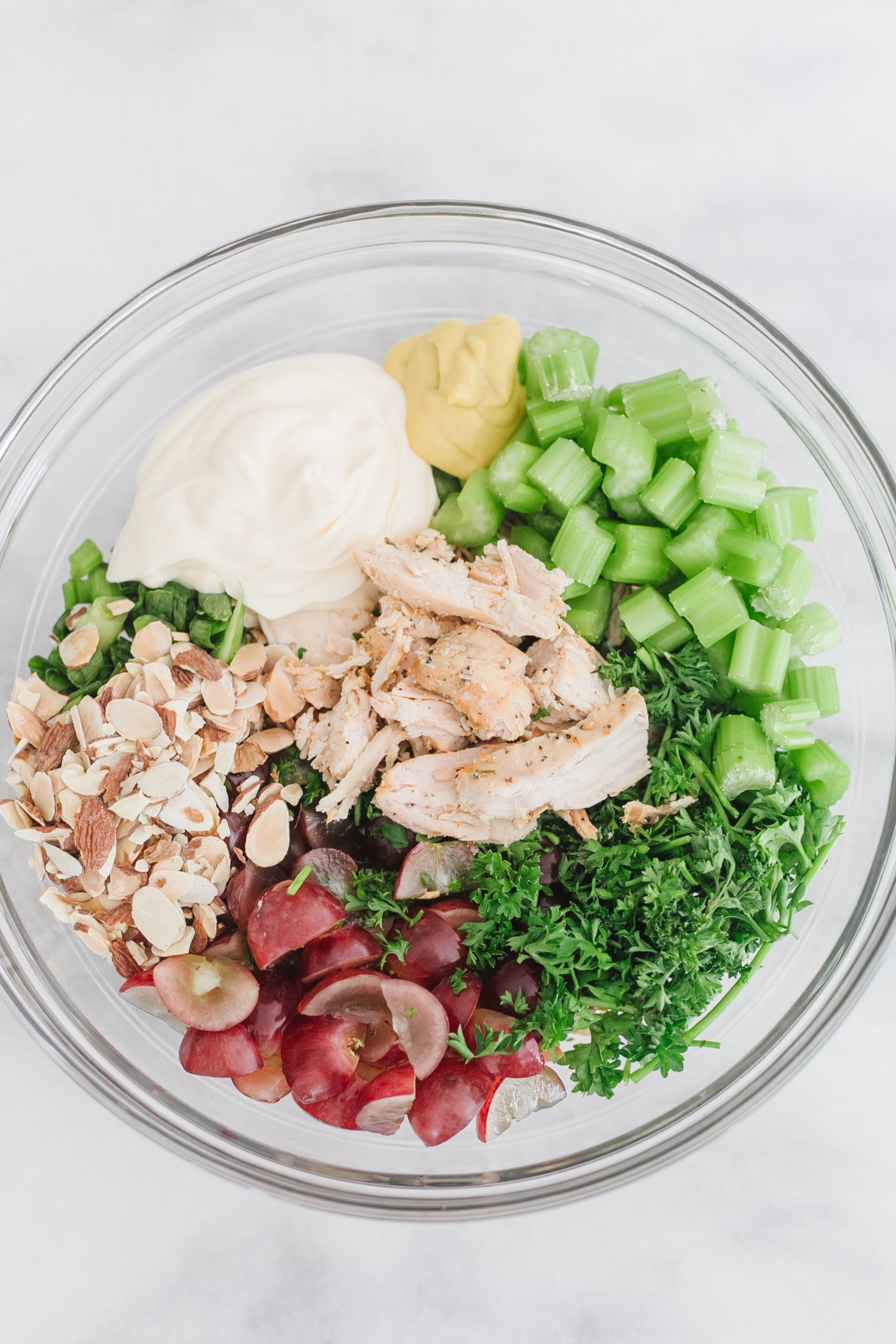 Chicken salad is undoubtedly a classic recipe. Diced chicken is tossed with a creamy dressing and dotted with crisp celery, green onion, and fresh grapes. Elevate Your Summer Chicken Salad with Walmart's Finest Ingredients! From Succulent Rotisserie Chicken to Fresh Produce, Find Everything You Need for the Ultimate Salad Creation! 🌞🥗🛒" @Walmart! #walmartpartner #walmartgrocery Fresh // flavorful // creamy // easy // healthy // vibrant // summer // classic // recipe // diced chicken // creamy dressing // crisp celery // green onion // fresh grapes // Dijon mustard // toasted almonds // parsley // chicken broth // lemon juice // salt // pepper // cold // chilled // sandwich // chips