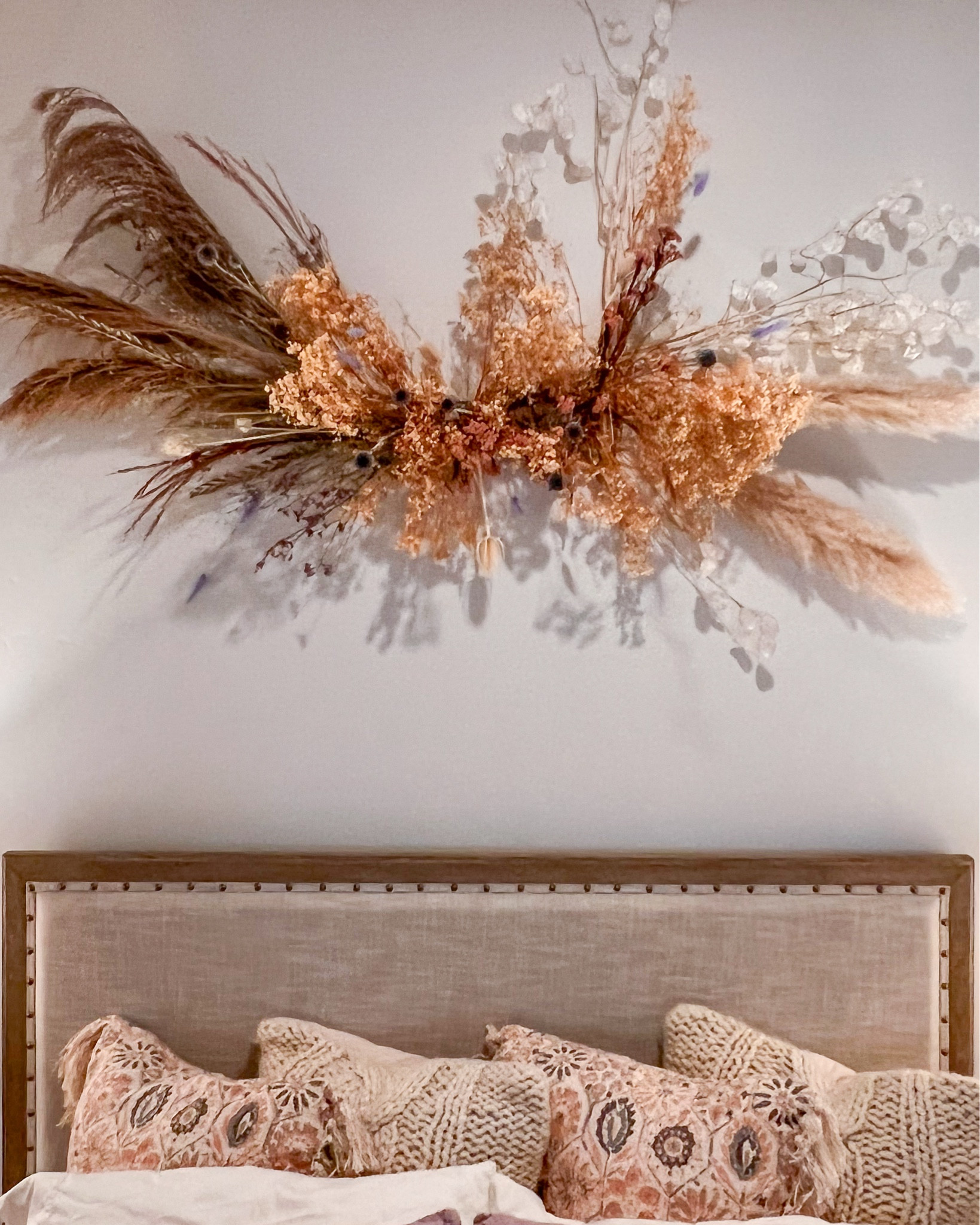 Welcoming, warm, and easy to settle into. We love how the dried florals create a statement—an artful alternative to the expected artwork above the bed.

#LTKHome