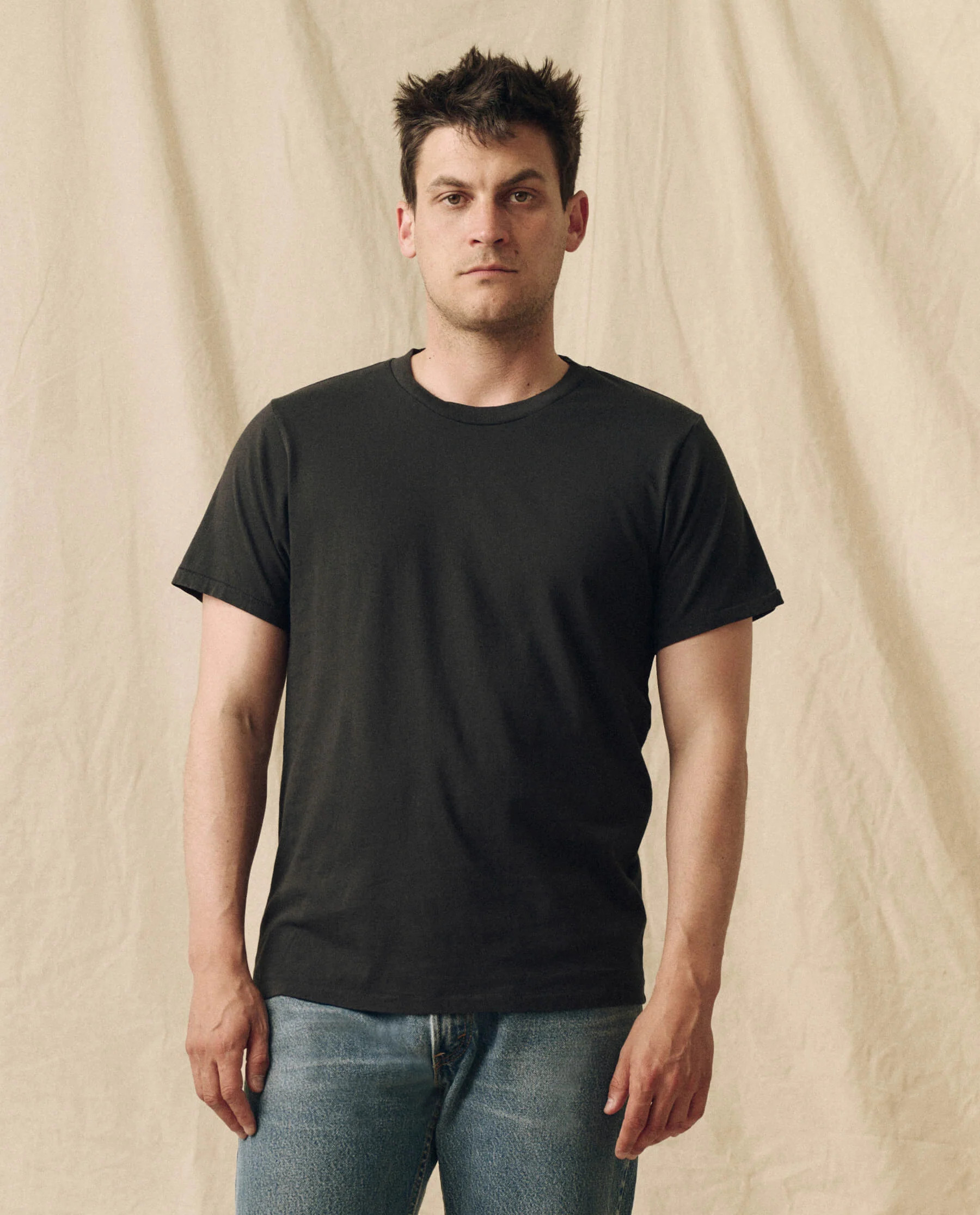 The Men's Pure Knits Slim Tee. Solid -- Almost Black | THE GREAT.